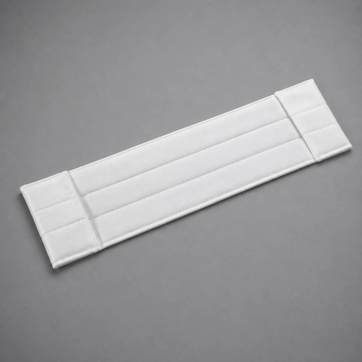 White rectangular cleanroom mop cover with three padded channels and end pockets